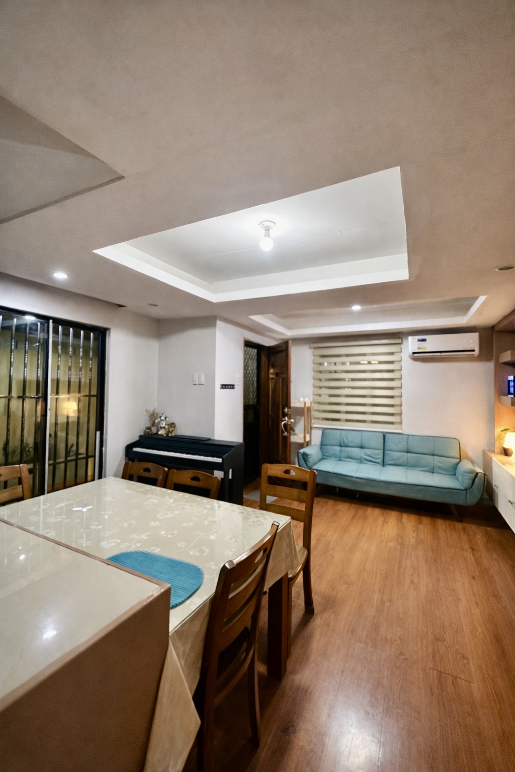 Dining area, living room, and piano